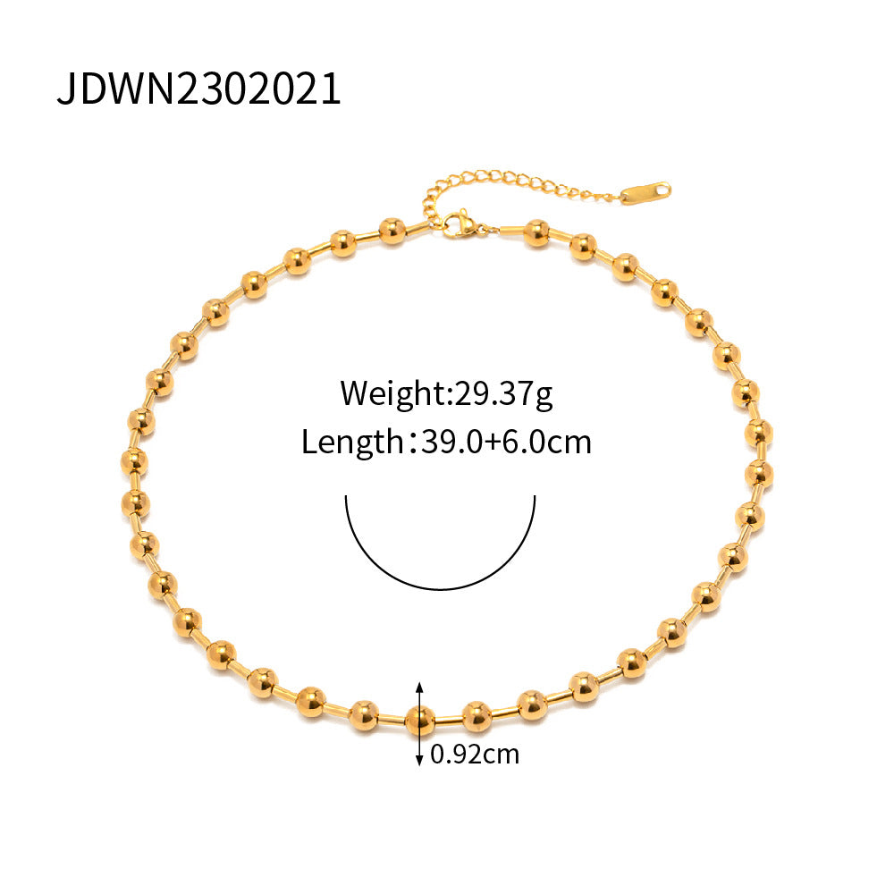 Minimalist Round Beaded Stainless Steel and Titanium Bracelet with 18K Gold Plating and Green Heart Zircon Charm