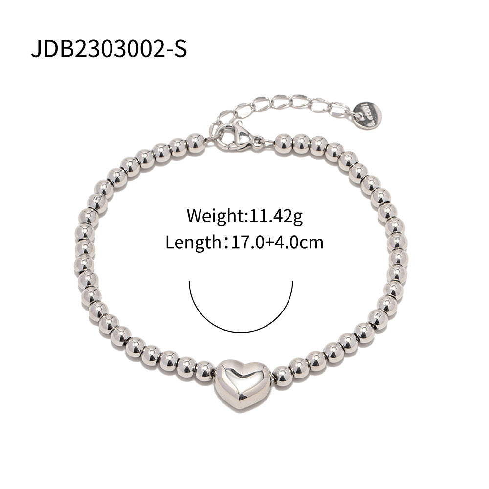 Minimalist Round Beaded Stainless Steel and Titanium Bracelet with 18K Gold Plating and Green Heart Zircon Charm