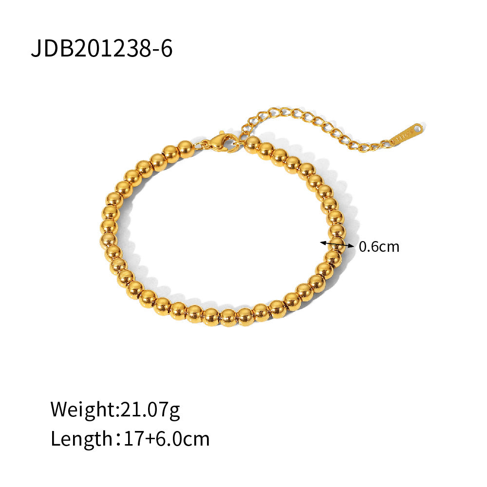 Minimalist Round Beaded Stainless Steel and Titanium Bracelet with 18K Gold Plating and Green Heart Zircon Charm