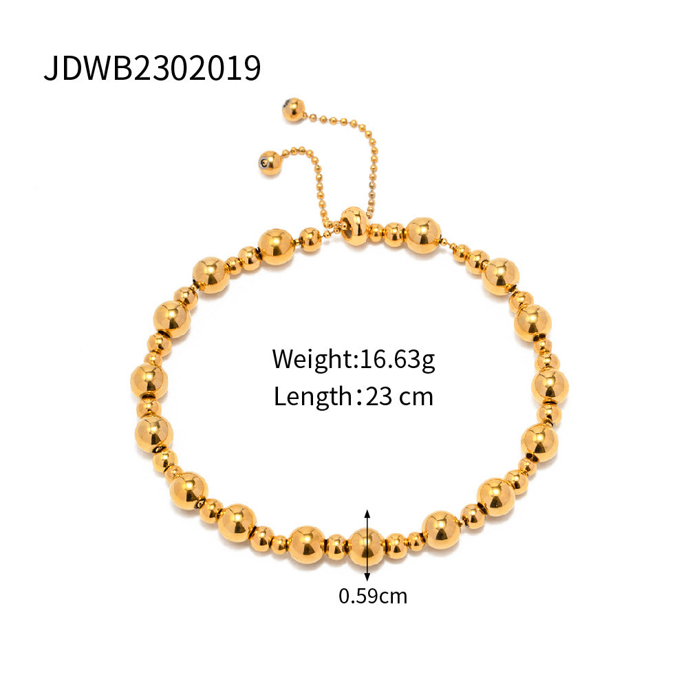 Minimalist Round Beaded Stainless Steel and Titanium Bracelet with 18K Gold Plating and Green Heart Zircon Charm