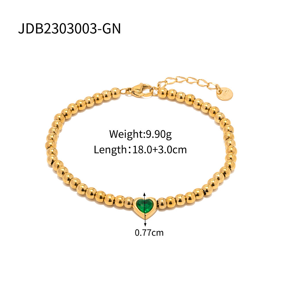 Minimalist Round Beaded Stainless Steel and Titanium Bracelet with 18K Gold Plating and Green Heart Zircon Charm