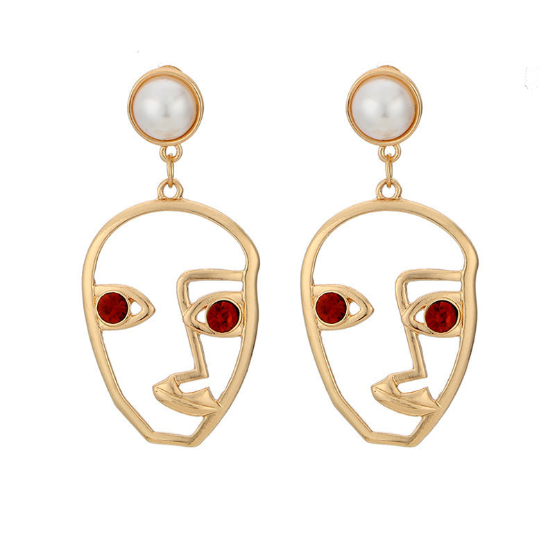 Gold Abstract Face Dangle Earrings with Hollow Eye Design
