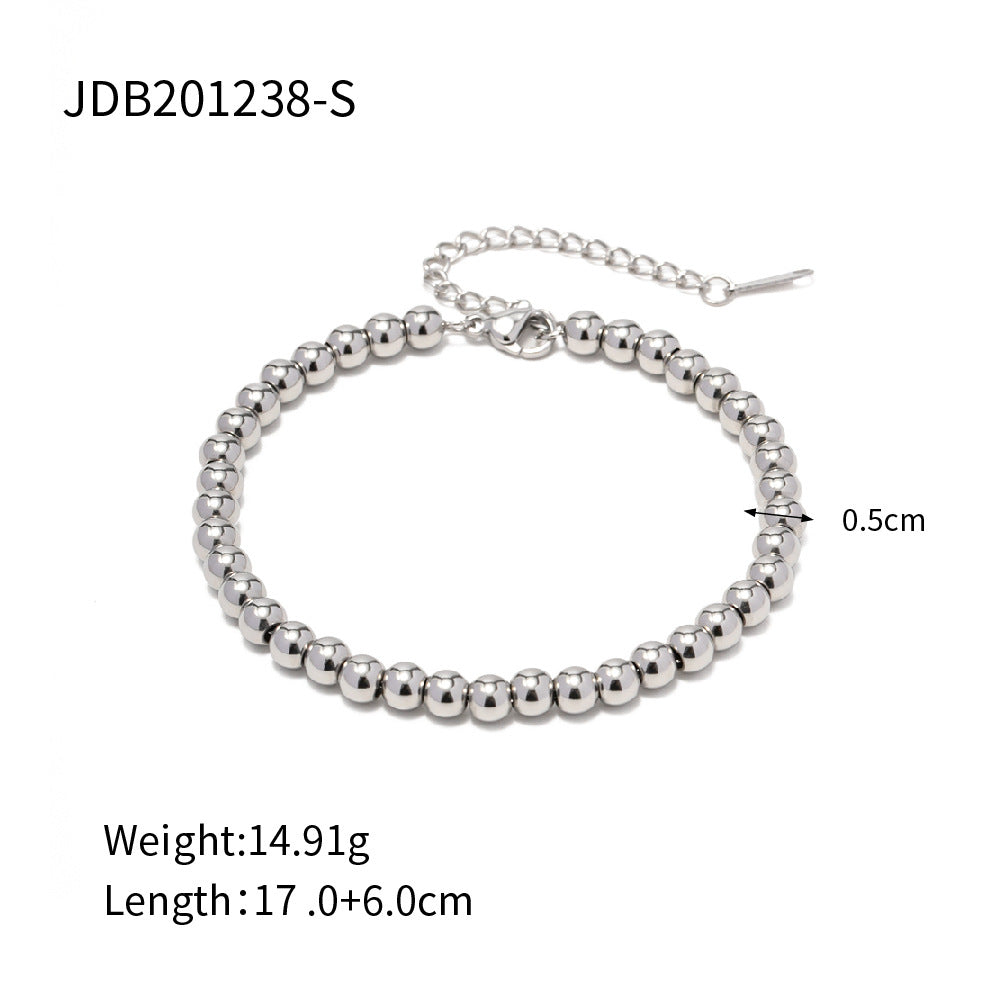 Minimalist Round Beaded Stainless Steel and Titanium Bracelet with 18K Gold Plating and Green Heart Zircon Charm