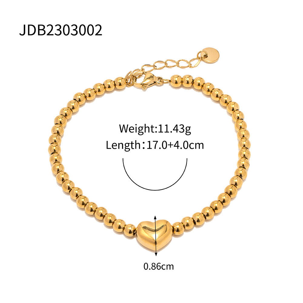 Minimalist Round Beaded Stainless Steel and Titanium Bracelet with 18K Gold Plating and Green Heart Zircon Charm