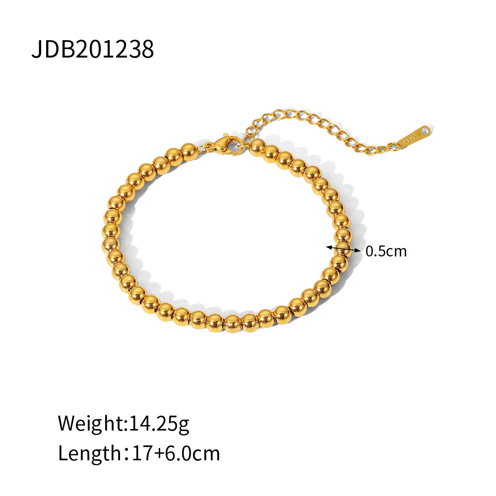 Minimalist Round Beaded Stainless Steel and Titanium Bracelet with 18K Gold Plating and Green Heart Zircon Charm