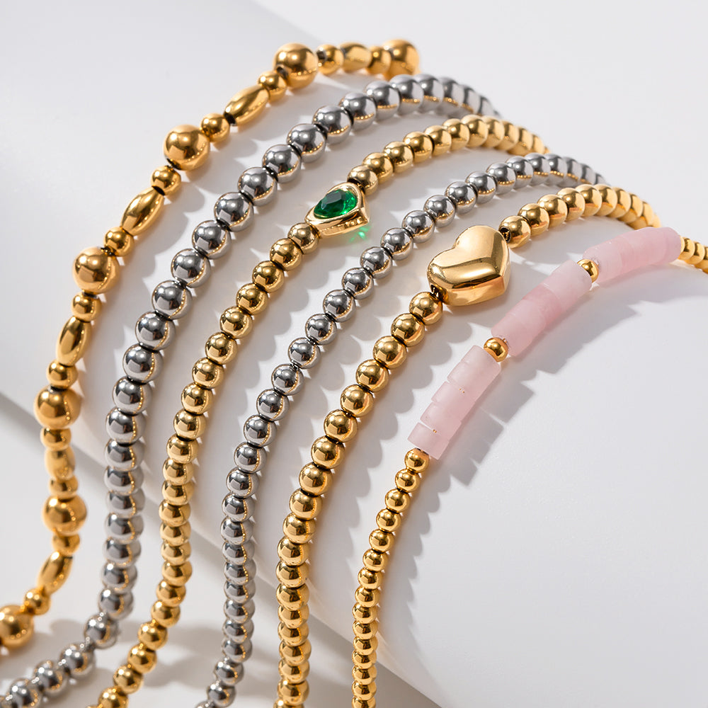 Minimalist Round Beaded Stainless Steel and Titanium Bracelet with 18K Gold Plating and Green Heart Zircon Charm