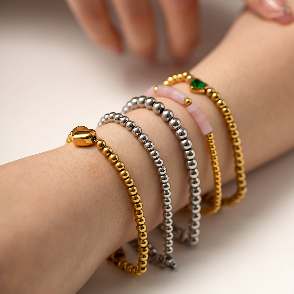Minimalist Round Beaded Stainless Steel and Titanium Bracelet with 18K Gold Plating and Green Heart Zircon Charm