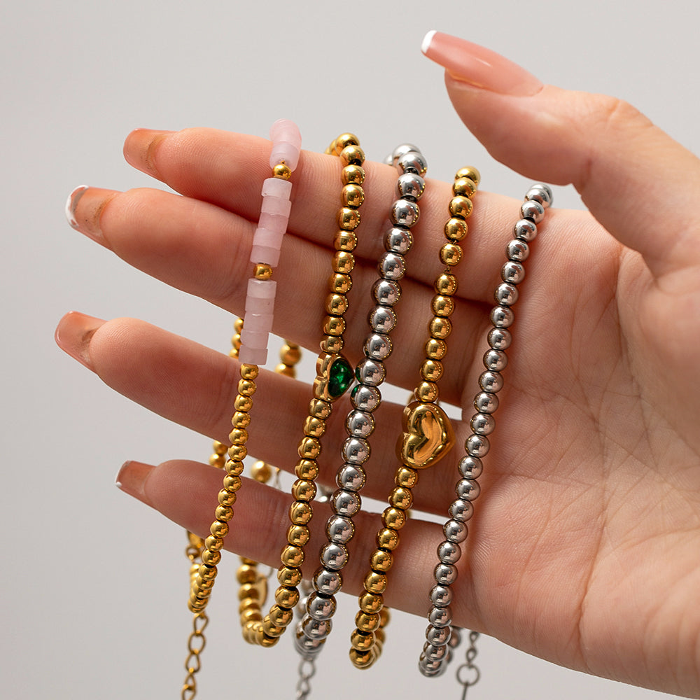Minimalist Round Beaded Stainless Steel and Titanium Bracelet with 18K Gold Plating and Green Heart Zircon Charm