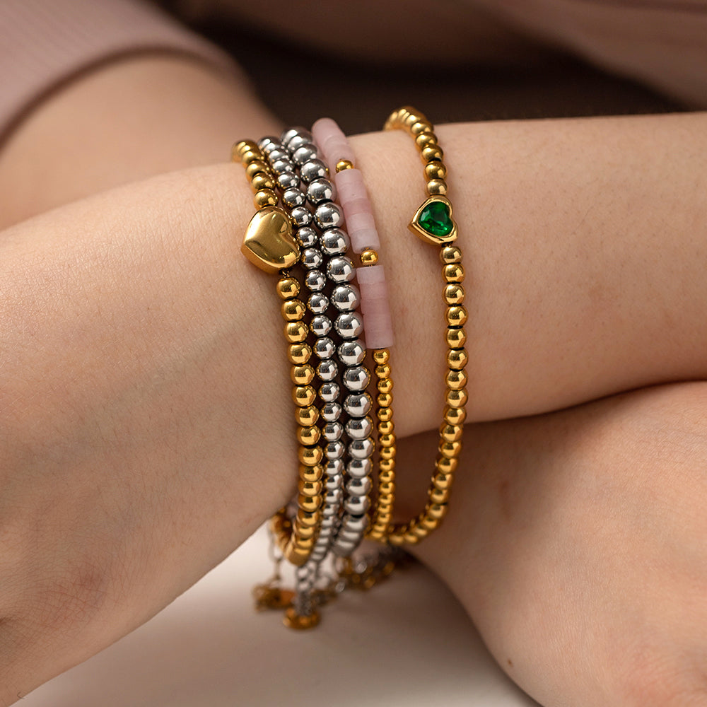Minimalist Round Beaded Stainless Steel and Titanium Bracelet with 18K Gold Plating and Green Heart Zircon Charm