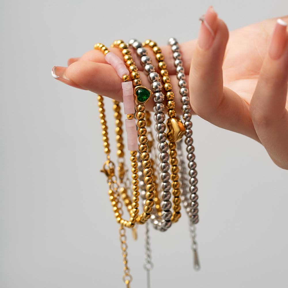 Minimalist Round Beaded Stainless Steel and Titanium Bracelet with 18K Gold Plating and Green Heart Zircon Charm
