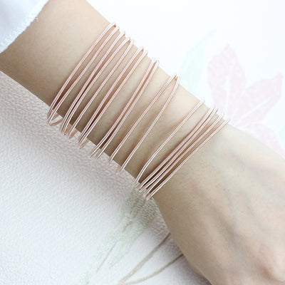 Minimalist Carbon Steel Plated Wristband with Adjustable Spring Design in Rose Gold and Silver