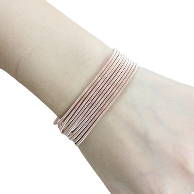 Minimalist Carbon Steel Plated Wristband with Adjustable Spring Design in Rose Gold and Silver