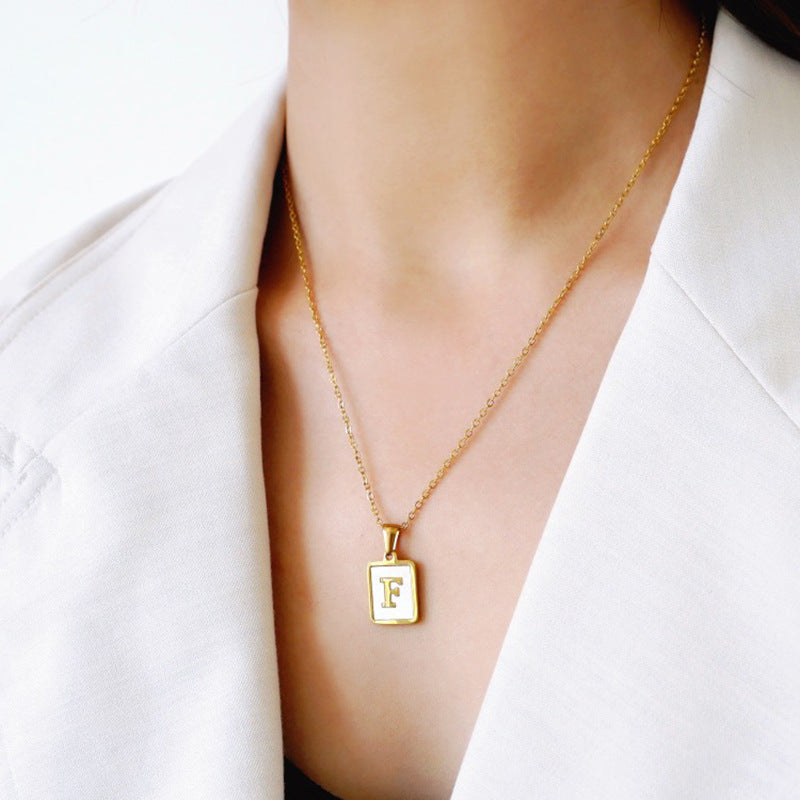Unisex 18k Gold Plated Stainless Steel Letter Pendant Necklace with White Shell Accents