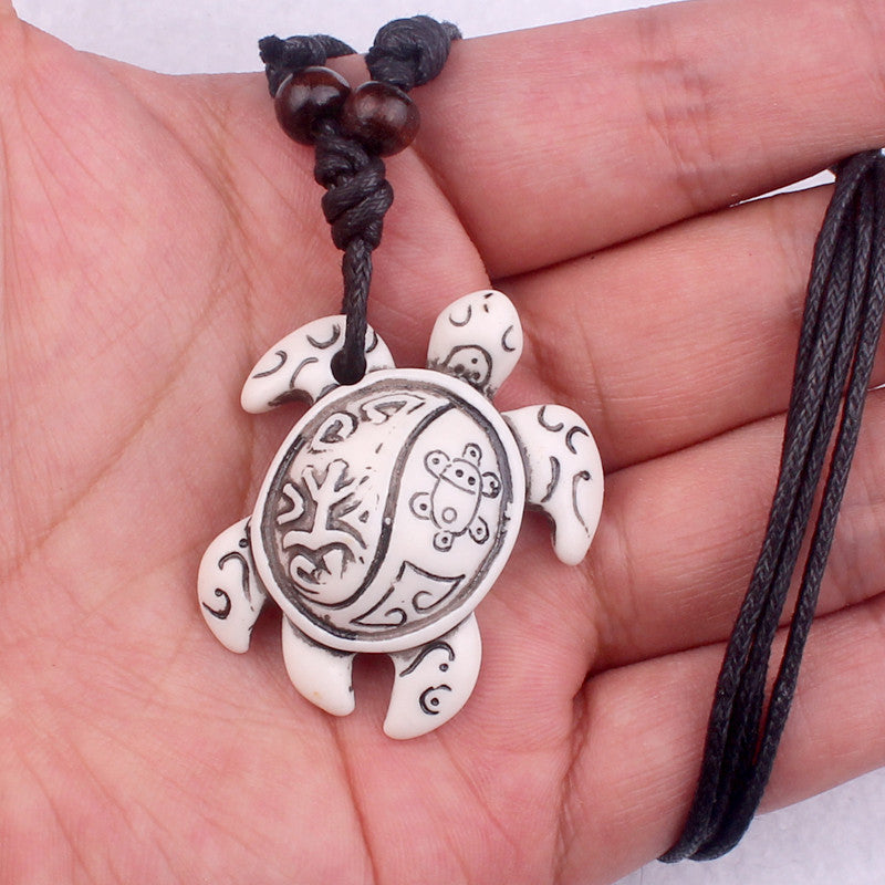 Ethnic Tortoise Resin Pendant Necklace with Faux Bone Carving