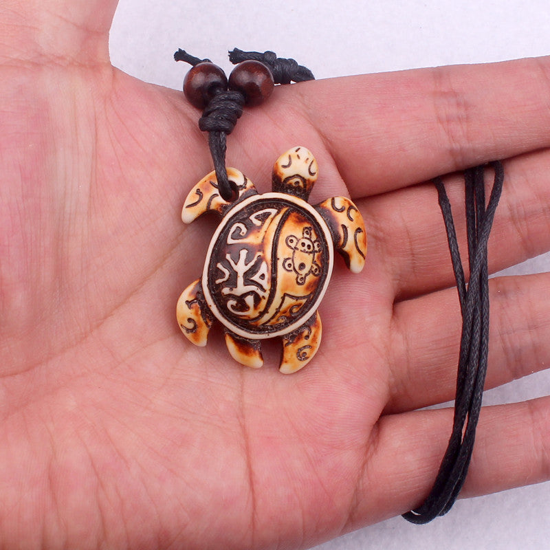 Ethnic Tortoise Resin Pendant Necklace with Faux Bone Carving