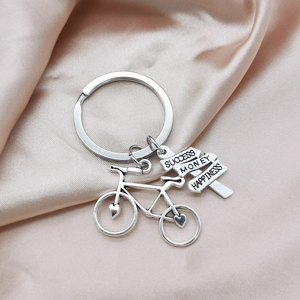 Casual Retro Bicycle Alloy Keychain with Direction Sign Pendant