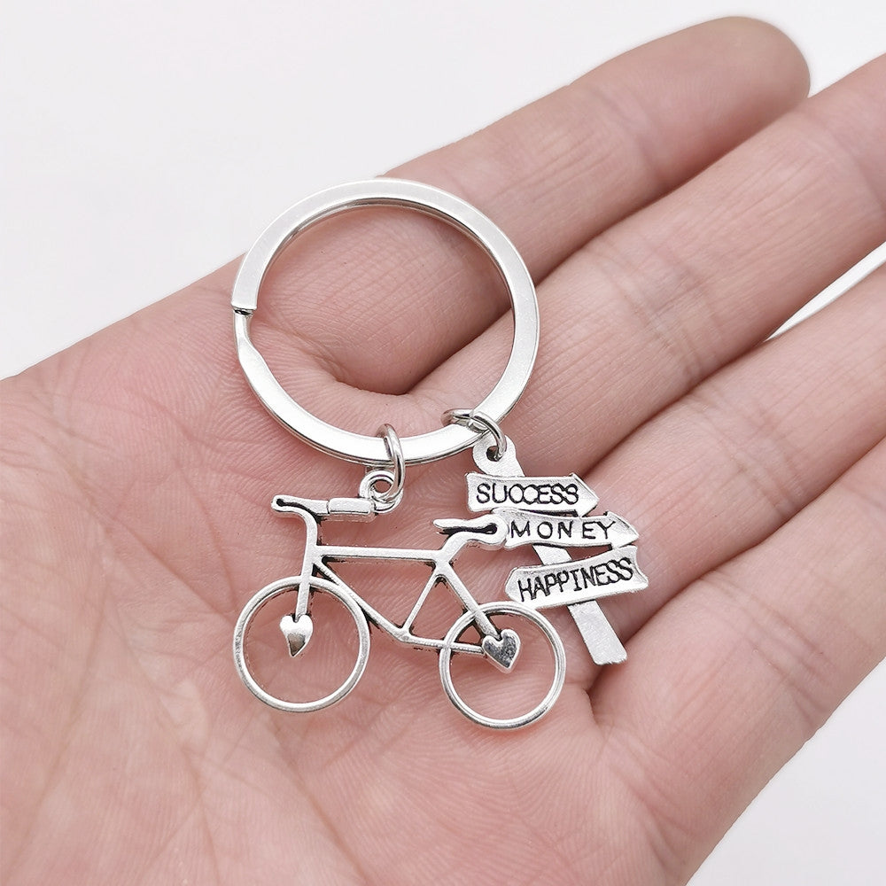 Casual Retro Bicycle Alloy Keychain with Direction Sign Pendant