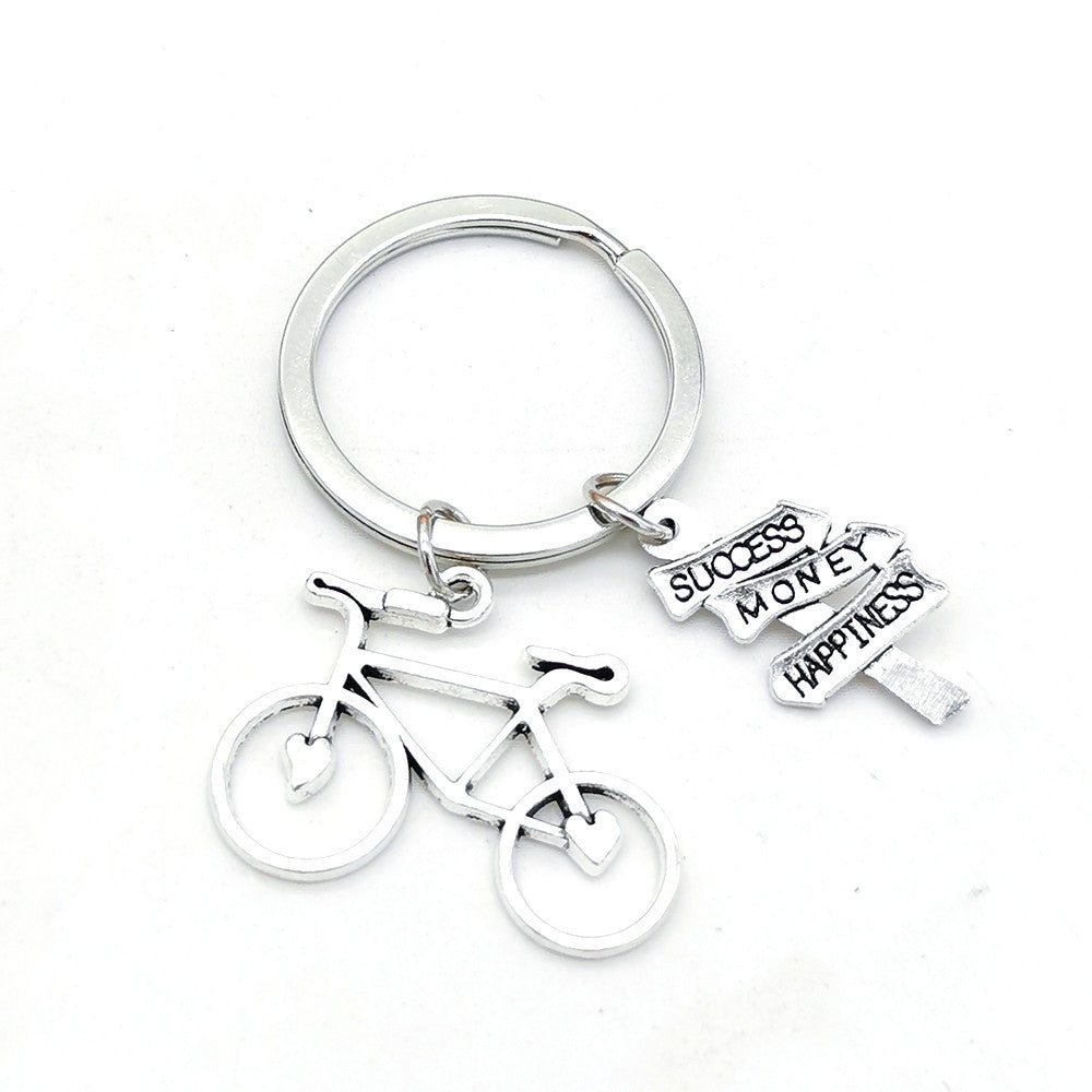 Casual Retro Bicycle Alloy Keychain with Direction Sign Pendant