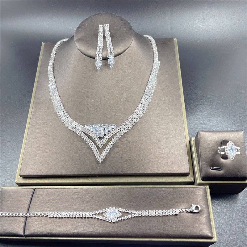 Classic Rhinestone Jewelry Set: Necklace, Earrings, Ring, and Bracelet for Bridal and Evening Wear