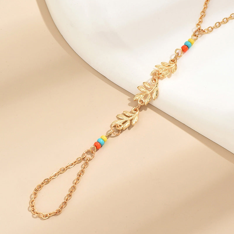 Elegant Leaf Alloy Plated Women's Bracelet with Rice Bead Finger Chain