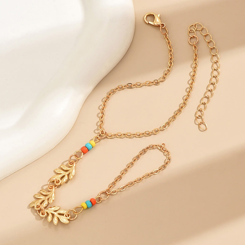 Elegant Leaf Alloy Plated Women's Bracelet with Rice Bead Finger Chain