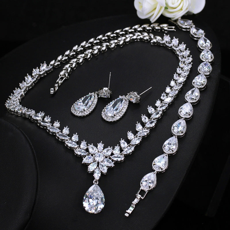 Luxurious Bridal Zirconia Snowflake Jewelry Set - Earrings, Necklace, and Bracelet in White Gold Plated Copper