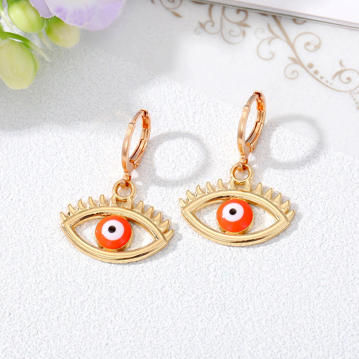 Retro Devil's Eye Alloy Drop Earrings with Hollow Eyelash Design