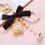 Cute Bow Knot Perfume Bottle Pearl Keychain for Women