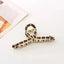 Geometric Alloy Ribbon Hair Claw with Cross Cut-Out Design