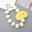 Sweet Flower Beaded Fur Ball Keychain and Phone Charm Bracelet