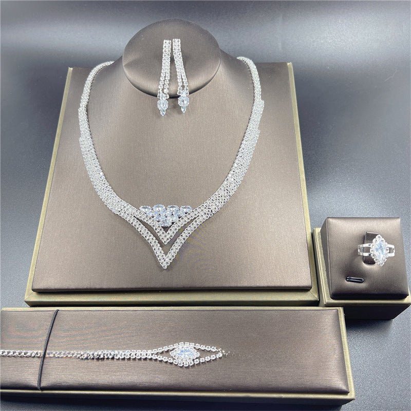 Classic Rhinestone Jewelry Set: Necklace, Earrings, Ring, and Bracelet for Bridal and Evening Wear