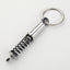 Simple Alloy Unisex Keychain with Creative Car Parts Design