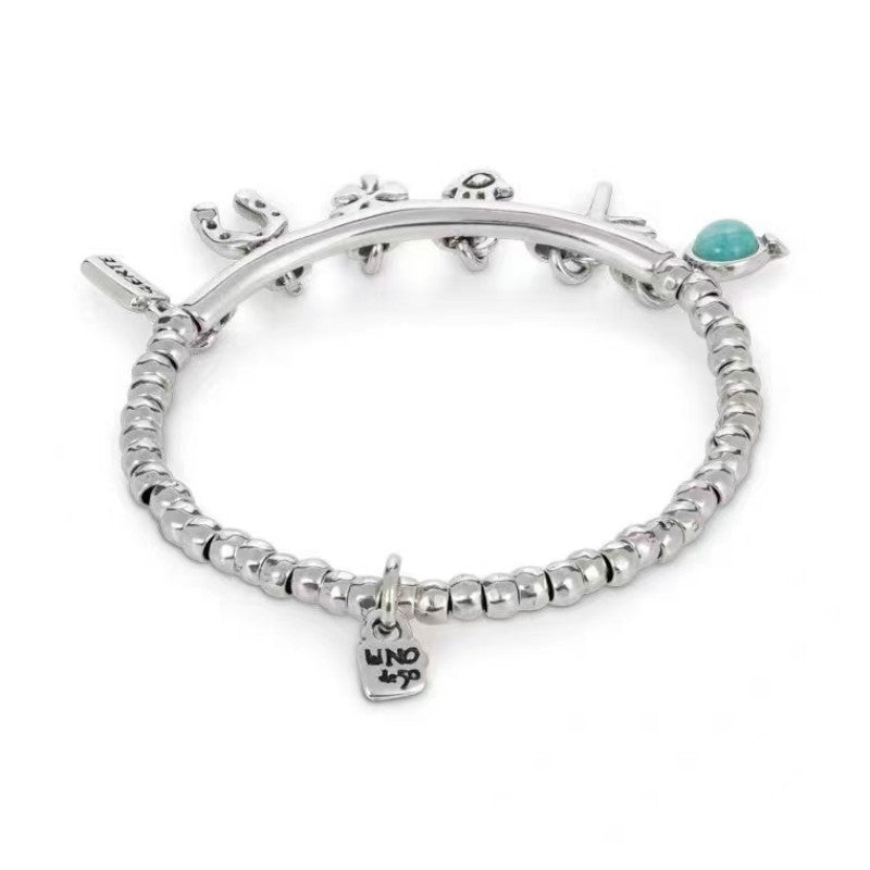 Turquoise Silver Plated Charm Bracelet with Tassel and Horseshoe Clover Design