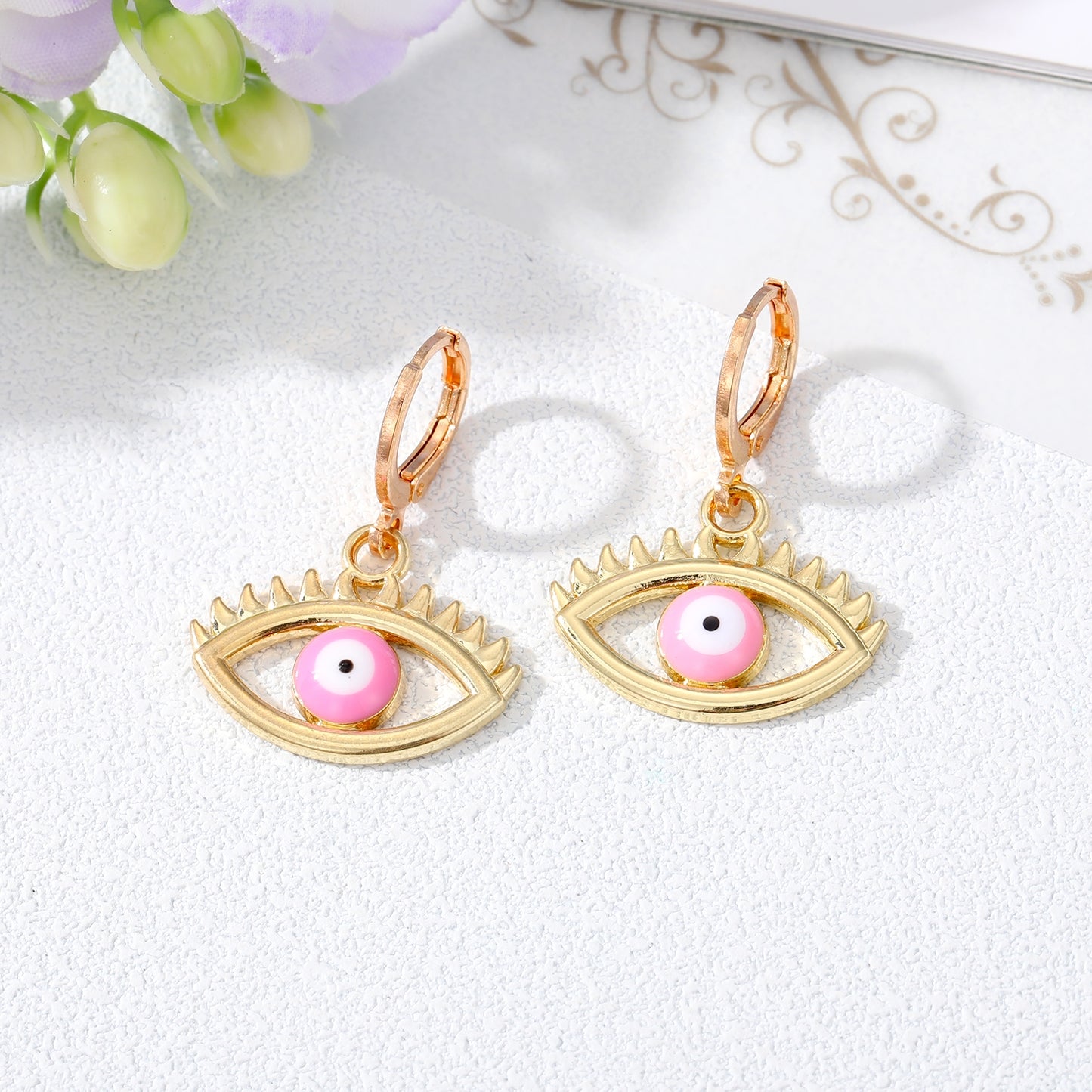 Retro Devil's Eye Alloy Drop Earrings with Hollow Eyelash Design