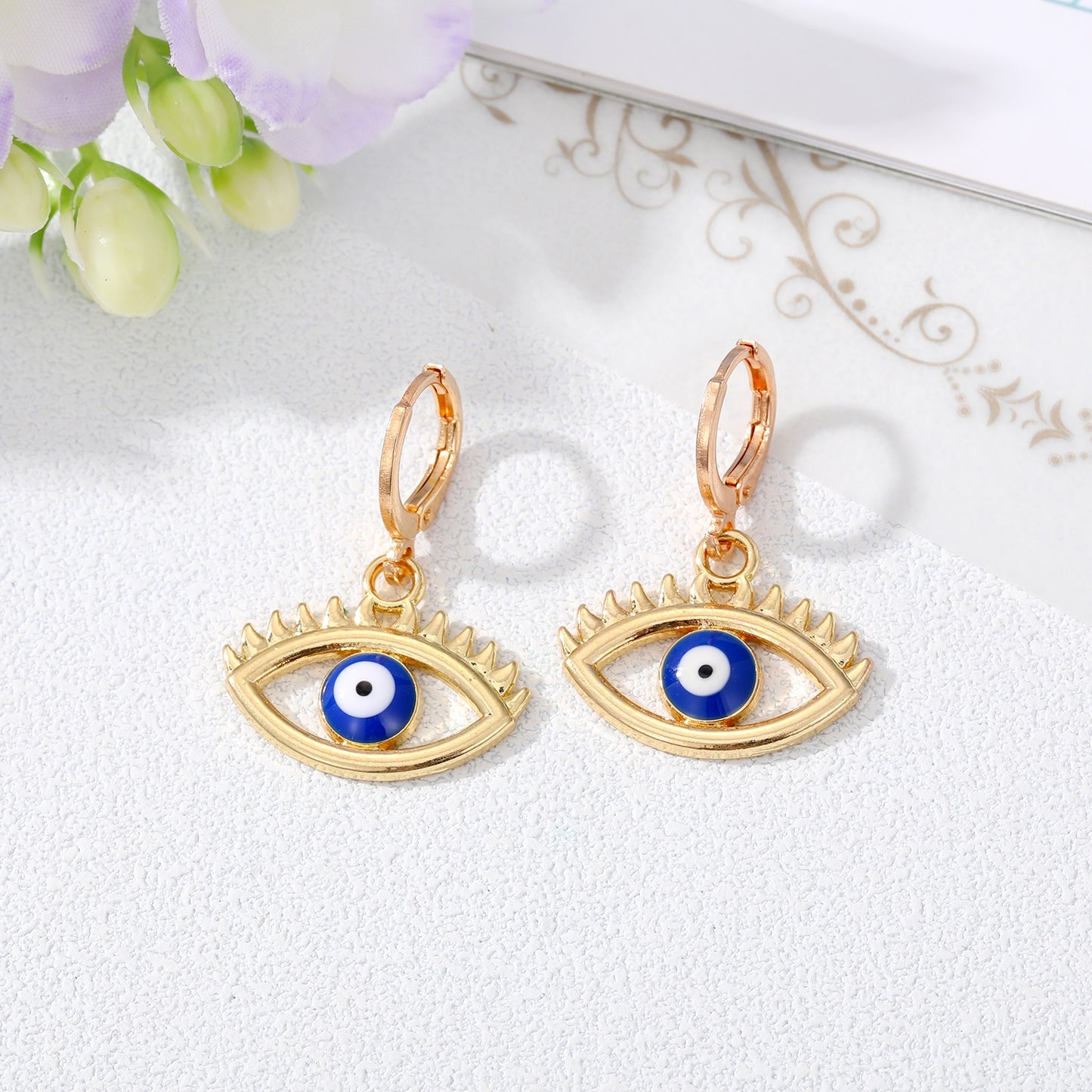 Retro Devil's Eye Alloy Drop Earrings with Hollow Eyelash Design