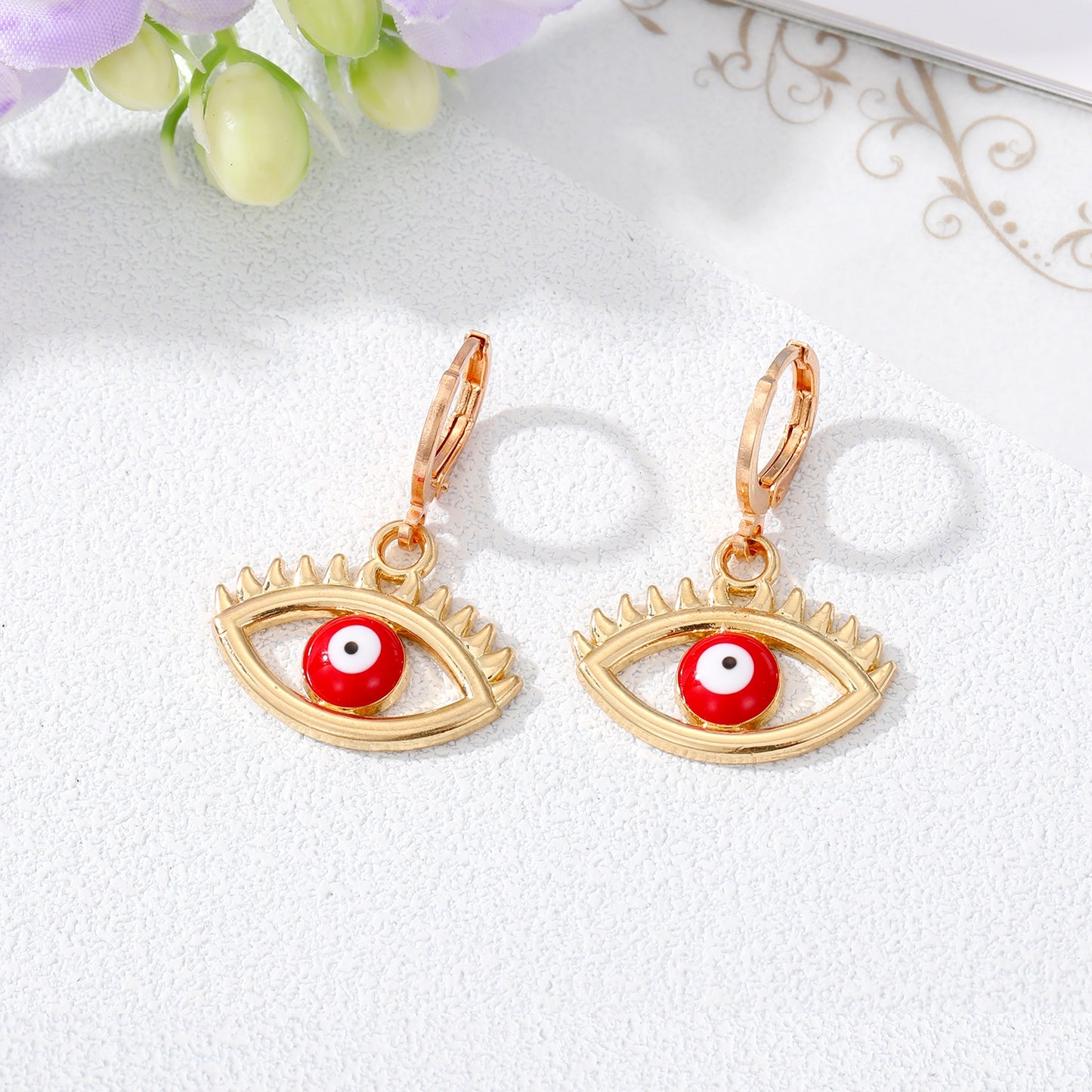 Retro Devil's Eye Alloy Drop Earrings with Hollow Eyelash Design